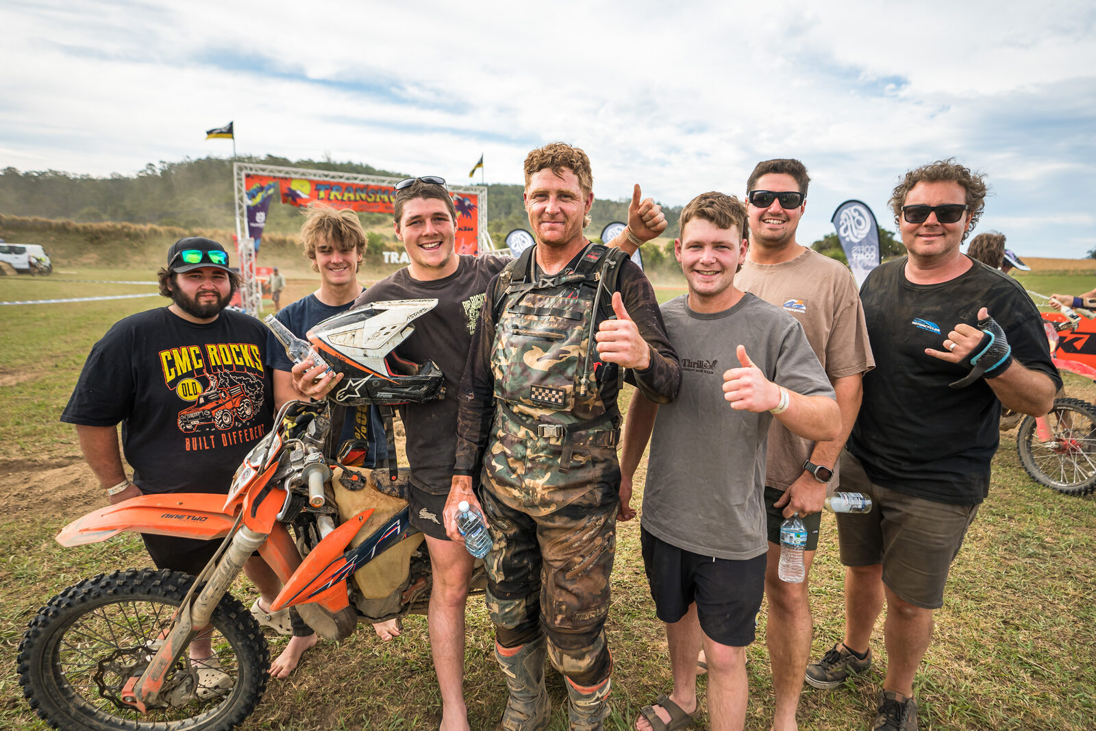 Muddy riders, thumbs up